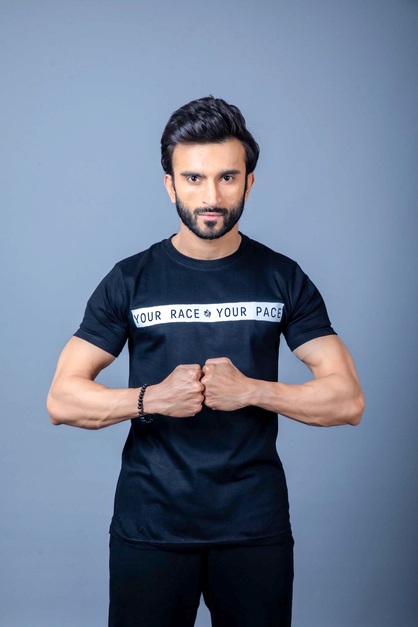 Man wearing trendy, moisture-wicking gym wear for an intense workout session