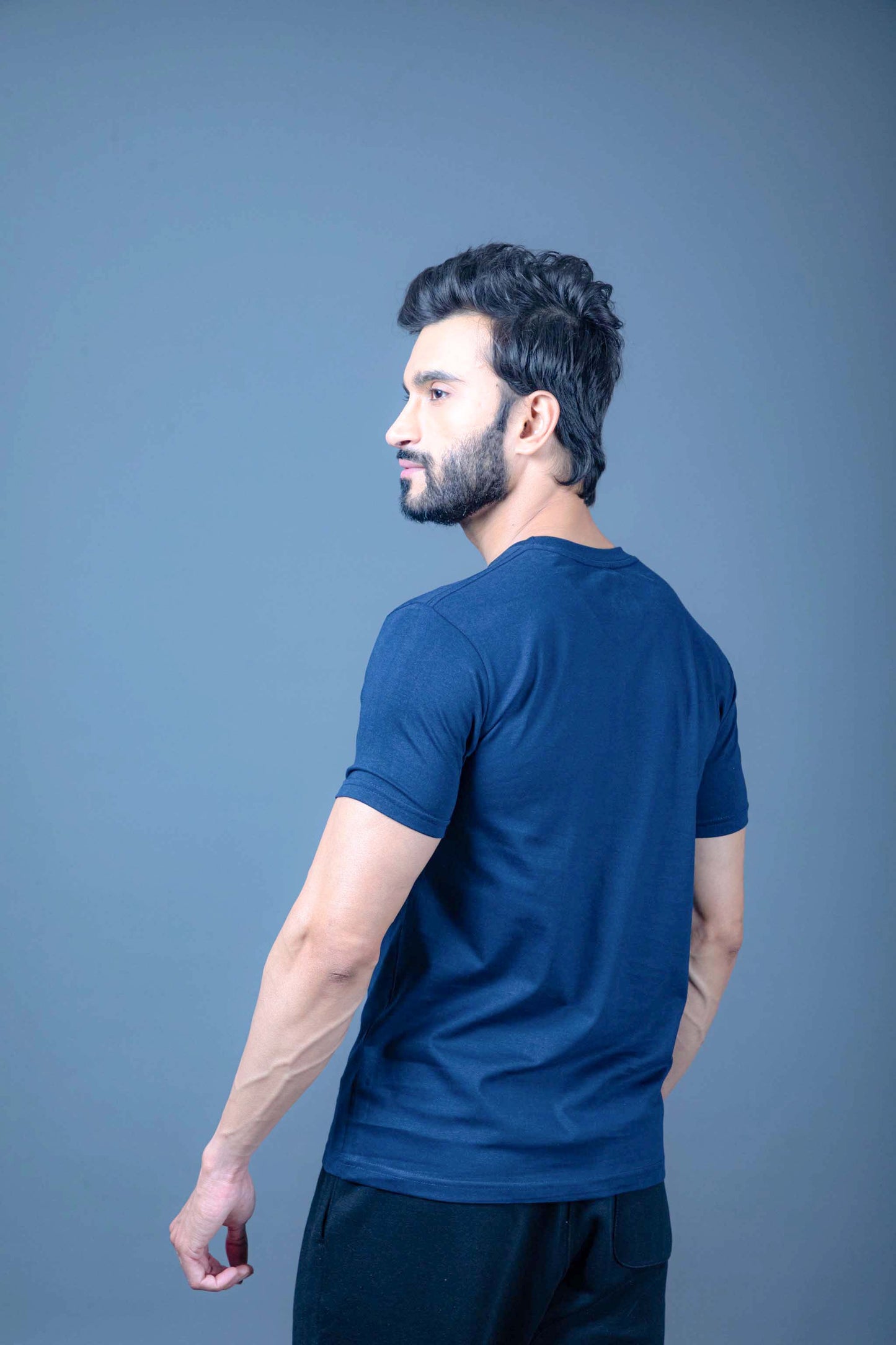 Man wearing dry fit gym t-shirt during a workout, designed for maximum breathability
